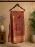 Elegant dusty rose saree featuring graceful floral prints in vibrant shades of blue, red, and beige. Finished with a rich golden woven border - Satin Tissue Saree