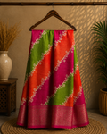 Graceful multicolor saree featuring striking diagonal panels in pink, green, and orange, beautifully accented with delicate floral vine prints with an elegant zari border - Cotton tissue soft Saree