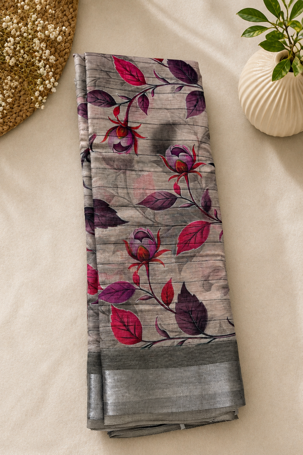 Elegant grey floral printed saree featuring graceful pink and purple botanical motifs on a subtle textured base. silver zari border- Cotton Saree