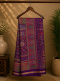 Elegant  royal purple saree, beautifully adorned with intricate multicolored traditional motifs  and subtle golden edging.
