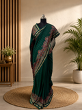 legant Heritage Inspired Saree With Traditional Motifs Comes With Green , Pink and Gold Zari Border Combination.