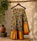 Beautiful Beige Khadi Cotton Saree Featuring vibrant traditional village-life and folk art prints with Rich golden zari woven border