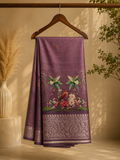 Elegant  lavender-purple saree featuring beautiful  illustrated bird and floral prints with rich woven zari border - Satin Tissue Saree