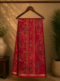 Elegant crimson red saree adorned with intricate heritage-inspired motifs and subtle golden edging.
