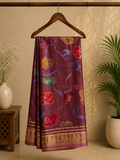 Elegant mauve-purple saree featuring a graceful floral print in vibrant shades of red, blue, and green. Accentuated with a rich golden woven border - Satin Tissue Saree