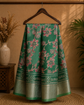Elegant green floral print saree, beautifully adorned with blooming floral motifs and a shimmering silver zari border- Cotton tissue soft Saree