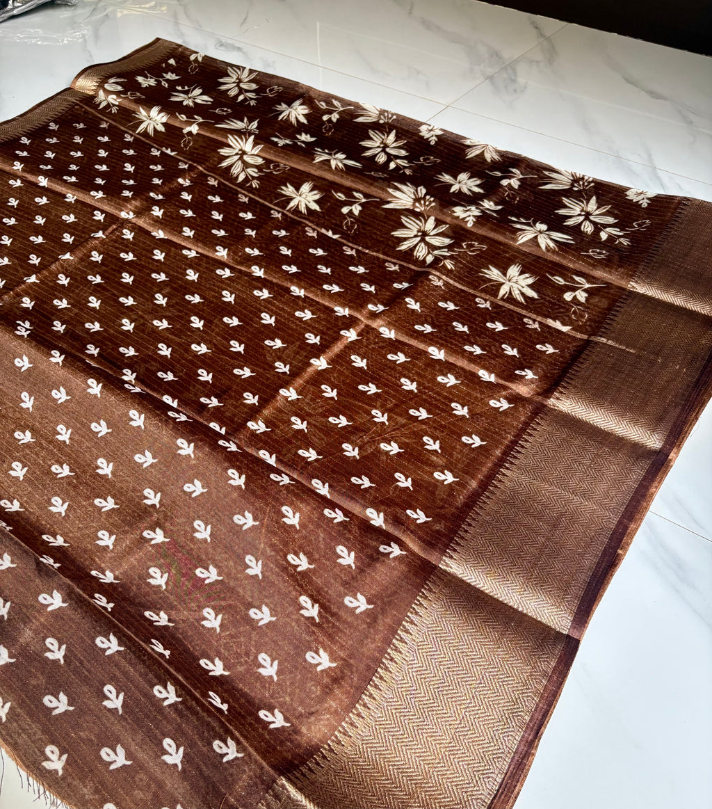 Elegant brown saree adorned with graceful ivory floral prints with Rich zari woven border - Fancy Saree.