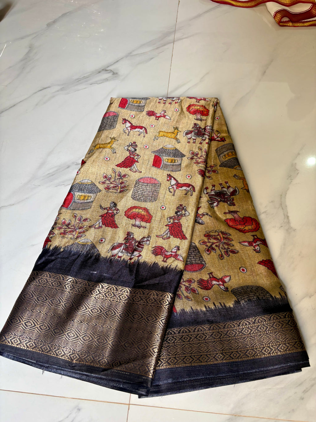 Beautiful Beige Khadi Cotton Saree Featuring vibrant traditional village-life and art prints with Rich Black zari woven border