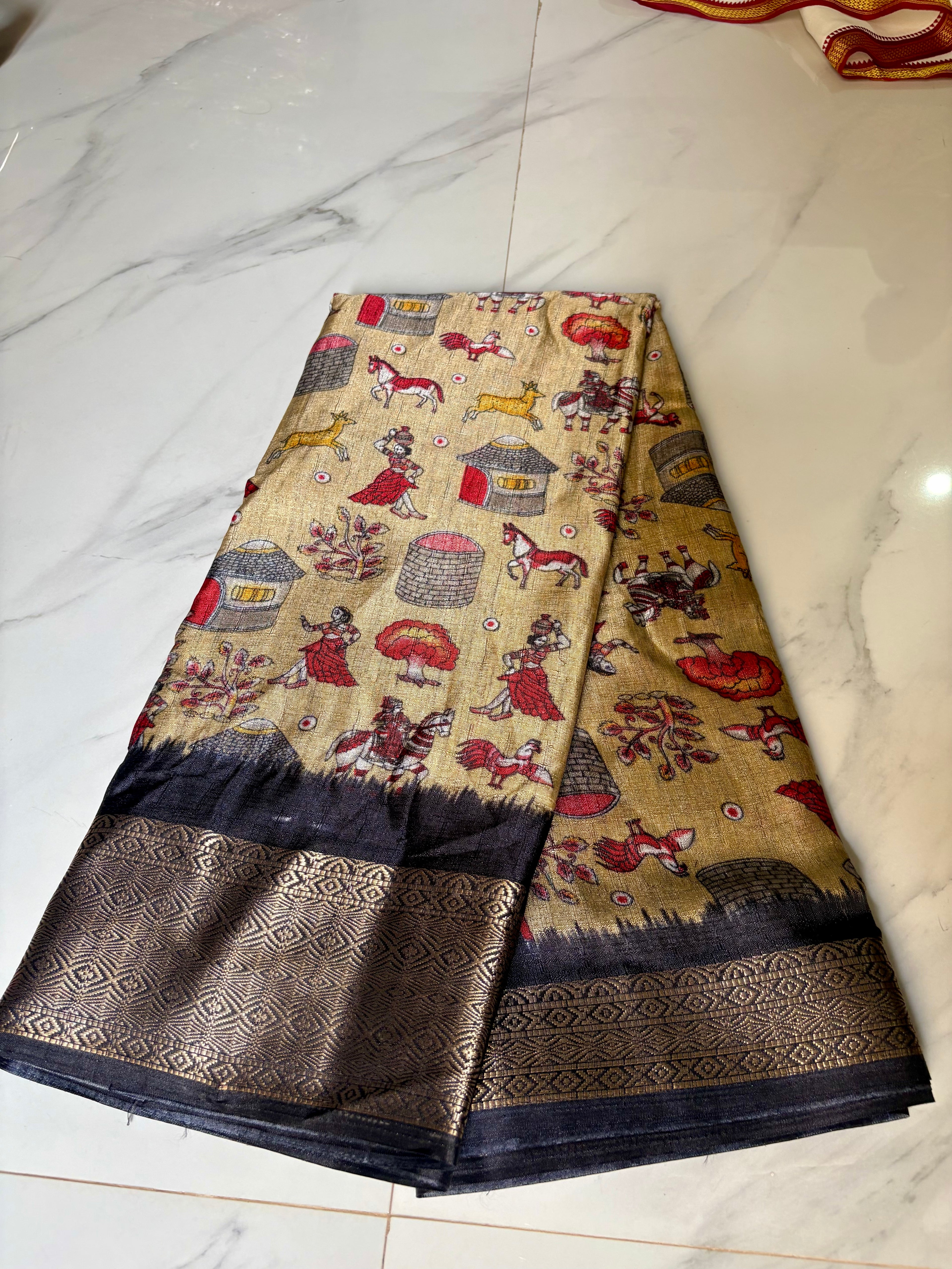 Beautiful Beige Khadi Cotton Saree Featuring vibrant traditional village-life and art prints with Rich Black zari woven border