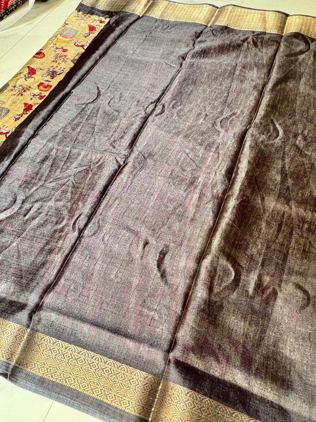 Beautiful Beige Khadi Cotton Saree Featuring vibrant traditional village-life and art prints with Rich Black zari woven border