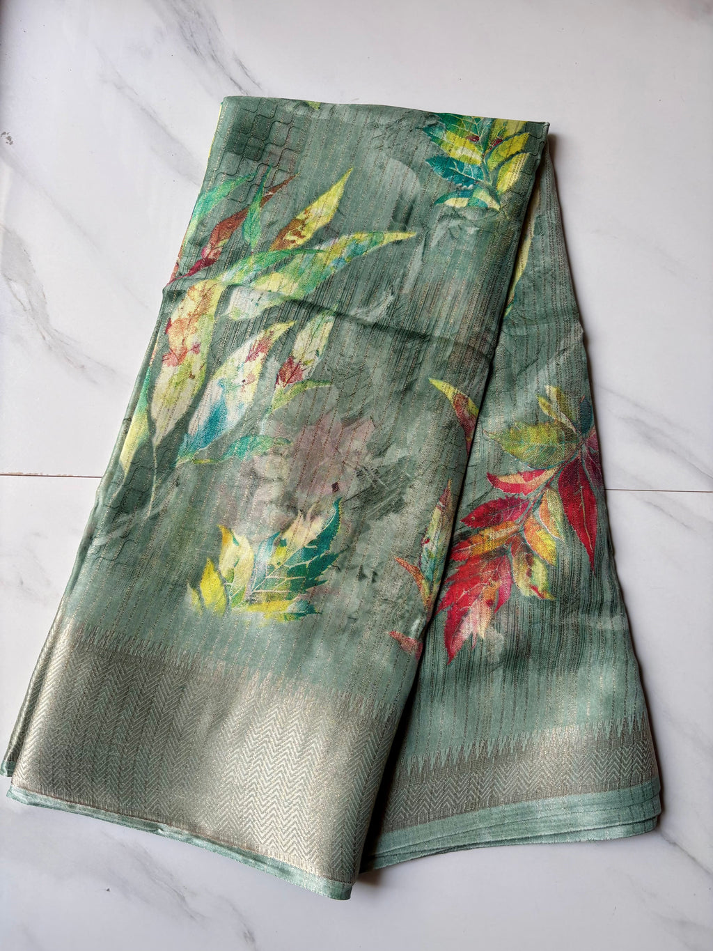 Elegant Sage Green saree adorned with Leaf prints with zari woven border - Fancy Saree Cotton Mix Satin Finish.