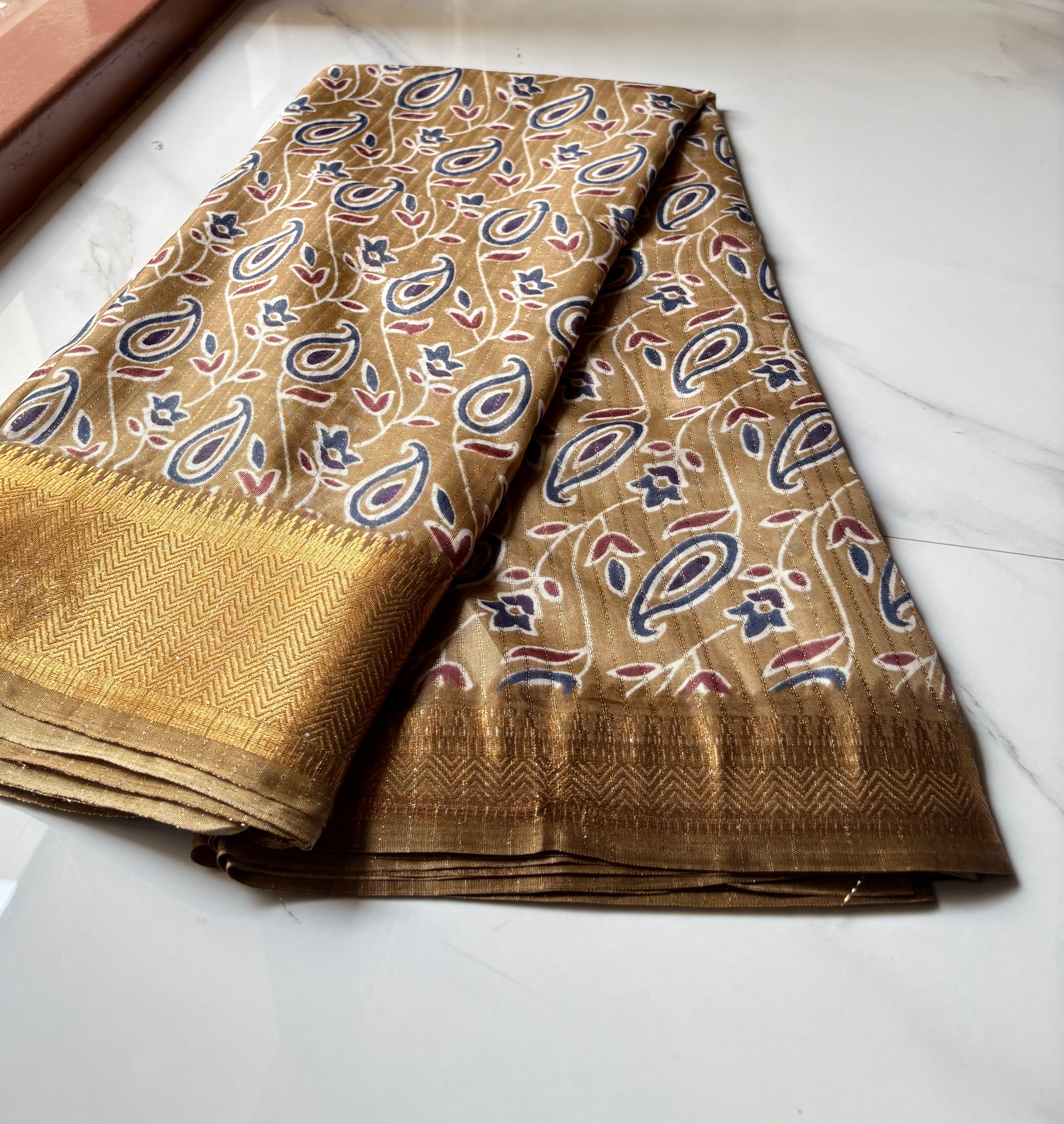 Elegant  beige-gold saree adorned with classic paisley and floral prints with zari woven border - Fancy Saree Cotton Mix Satin Finish.