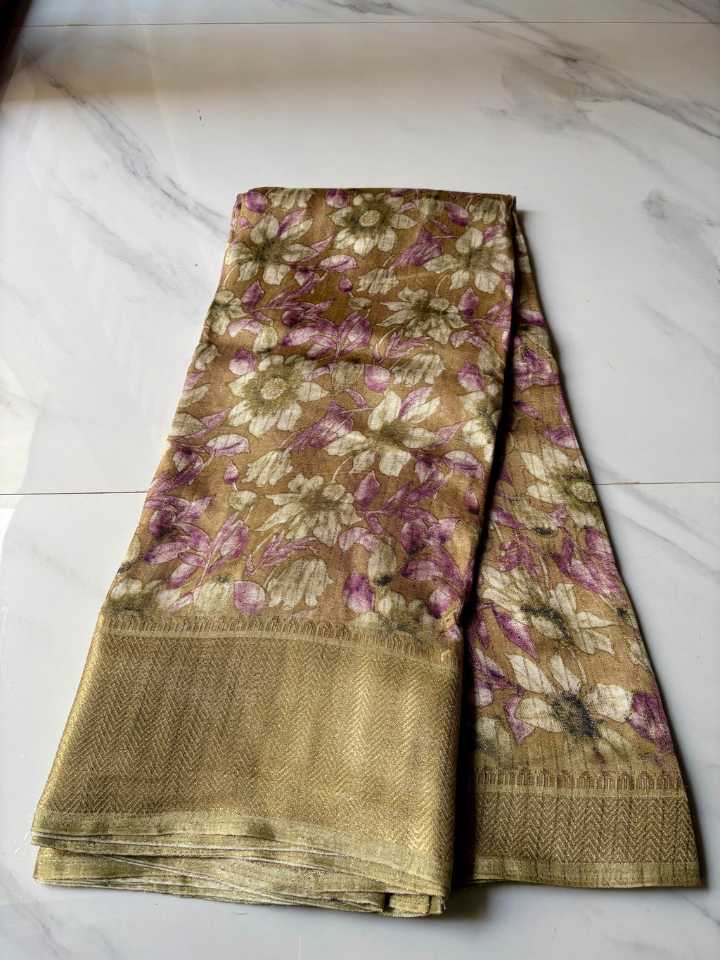 Elegant  beige-gold saree featuring soft floral prints in pastel pink and ivory with zari woven border - Fancy Saree Cotton Mix Satin Finish.