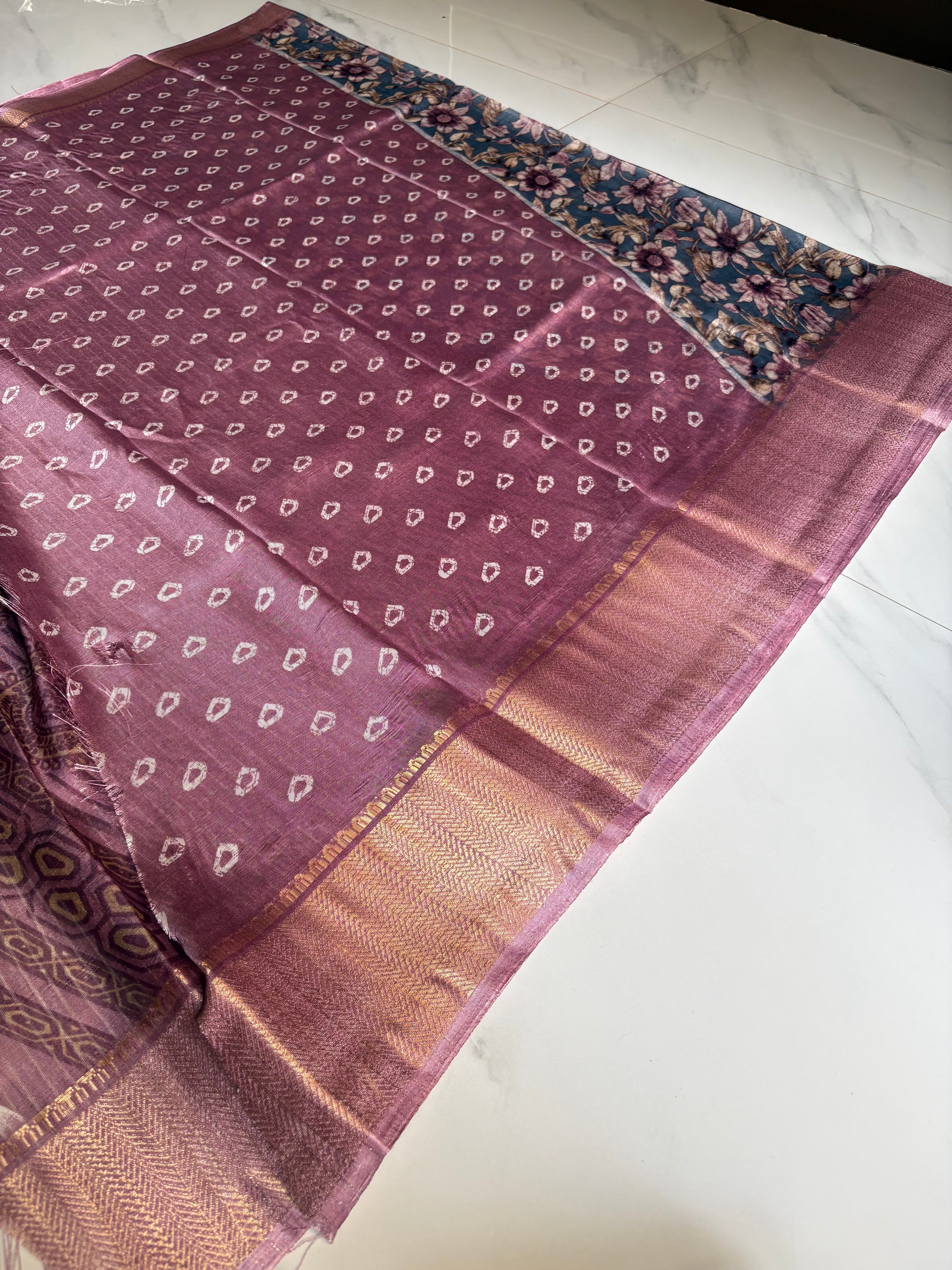 Elegant bluish-grey saree featuring graceful floral prints in soft lavender and beige tones with zari woven border - Fancy Saree Cotton Mix Satin Finish.