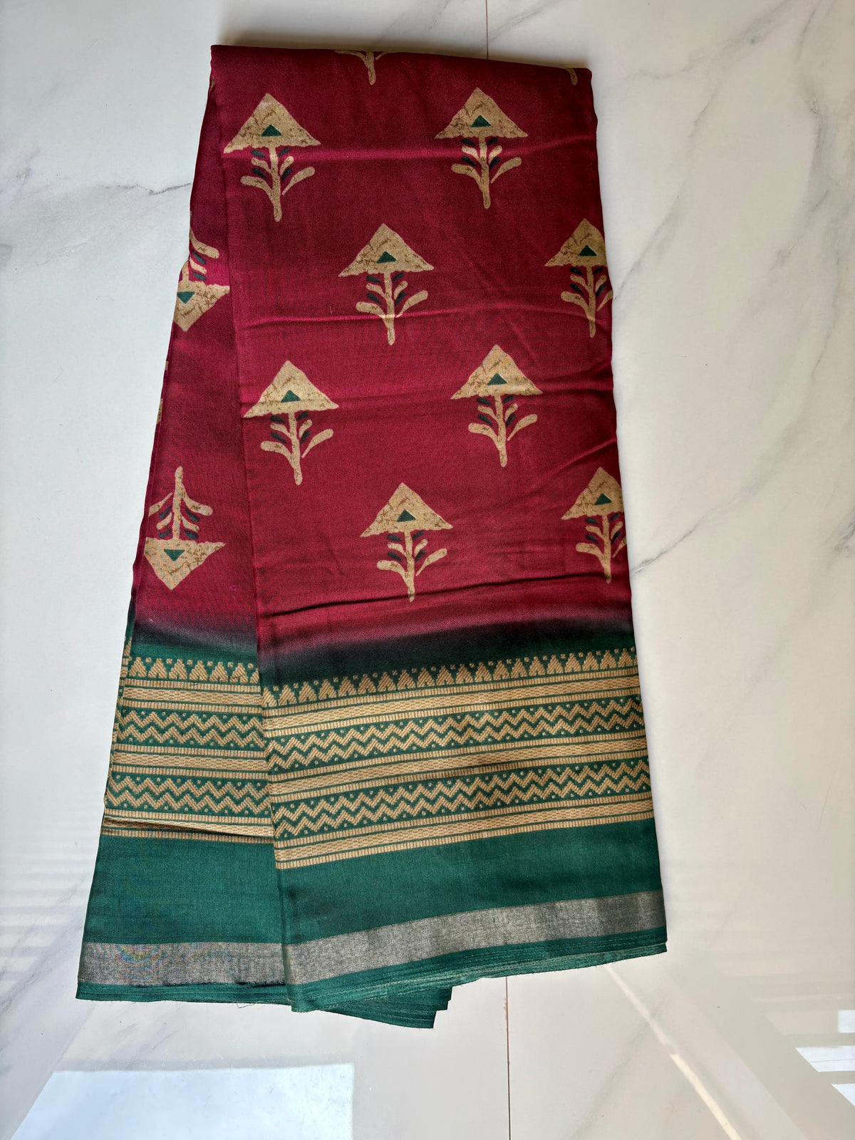 Elegant maroon saree featuring delicate beige motifs and a contrasting teal green border and silver zari line- Cotton silk soft Saree