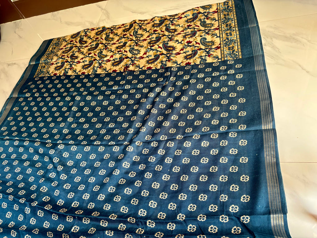 Elegant cream-colored saree featuring beautiful blue paisley and floral prints and silver zari line border - Cotton silk soft Saree