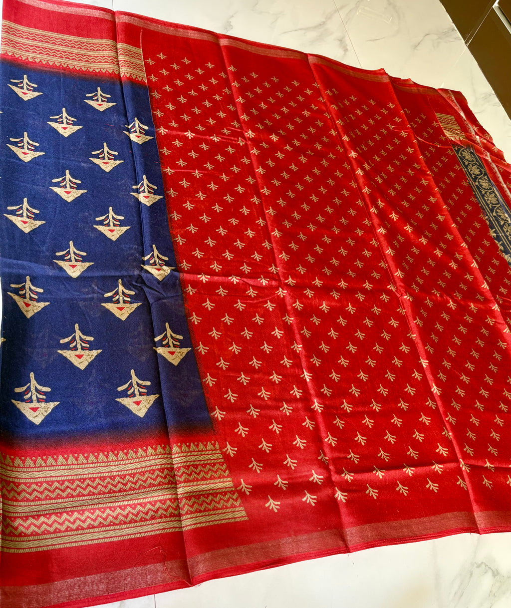 Elegant navy blue saree featuring subtle traditional motifs and a beautifully red-gold Zari Line border- Cotton silk soft Saree
