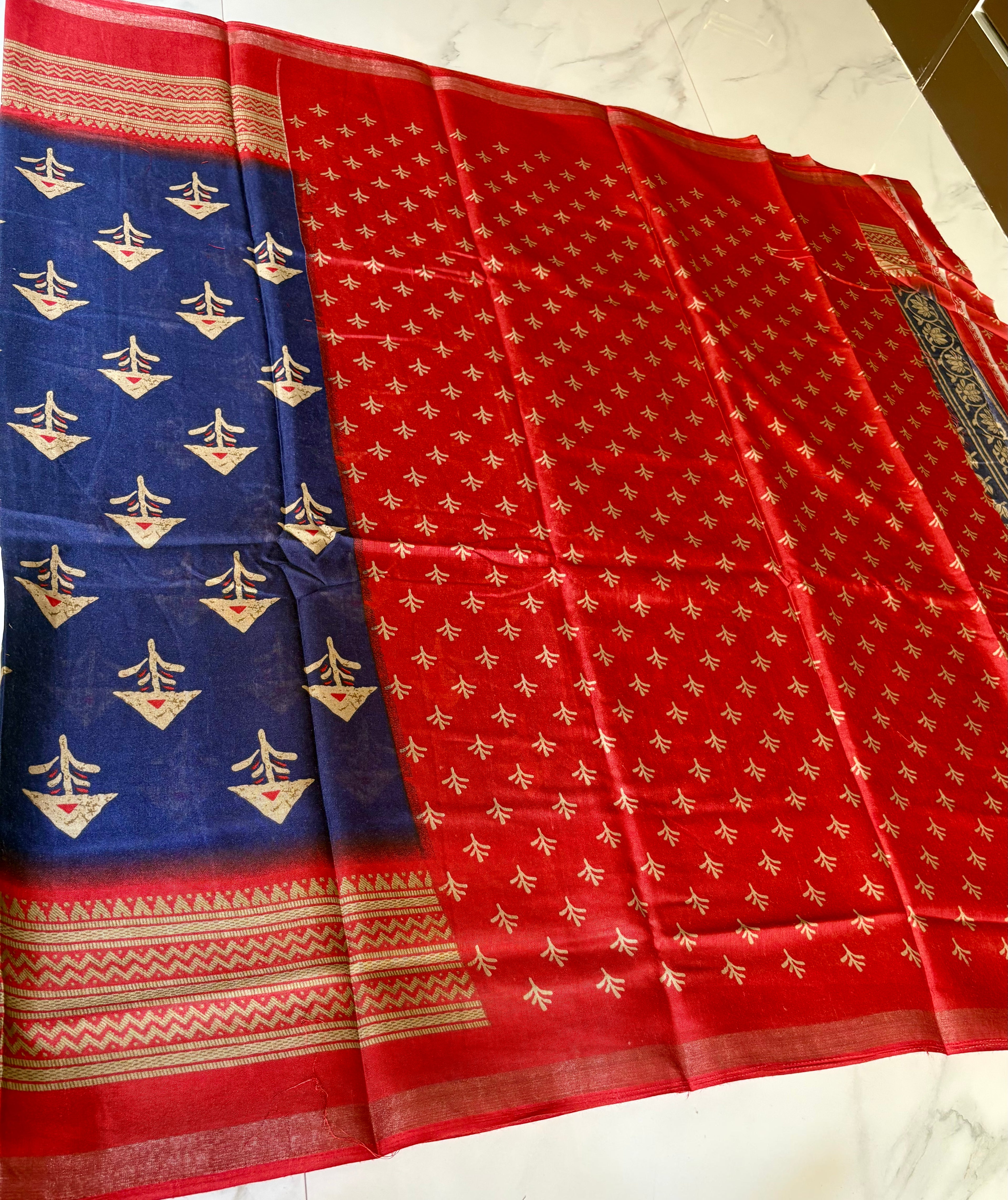 Elegant navy blue saree featuring subtle traditional motifs and a beautifully red-gold Zari Line border- Cotton silk soft Saree