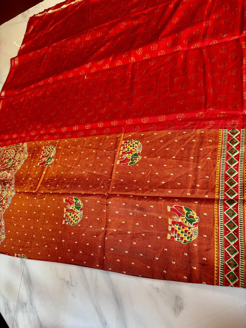 Gracefully designed in a rich rust-orange shade, this saree features elegant elephant and heritage-inspired temple motifs Zari Line border- Cotton silk soft Saree
