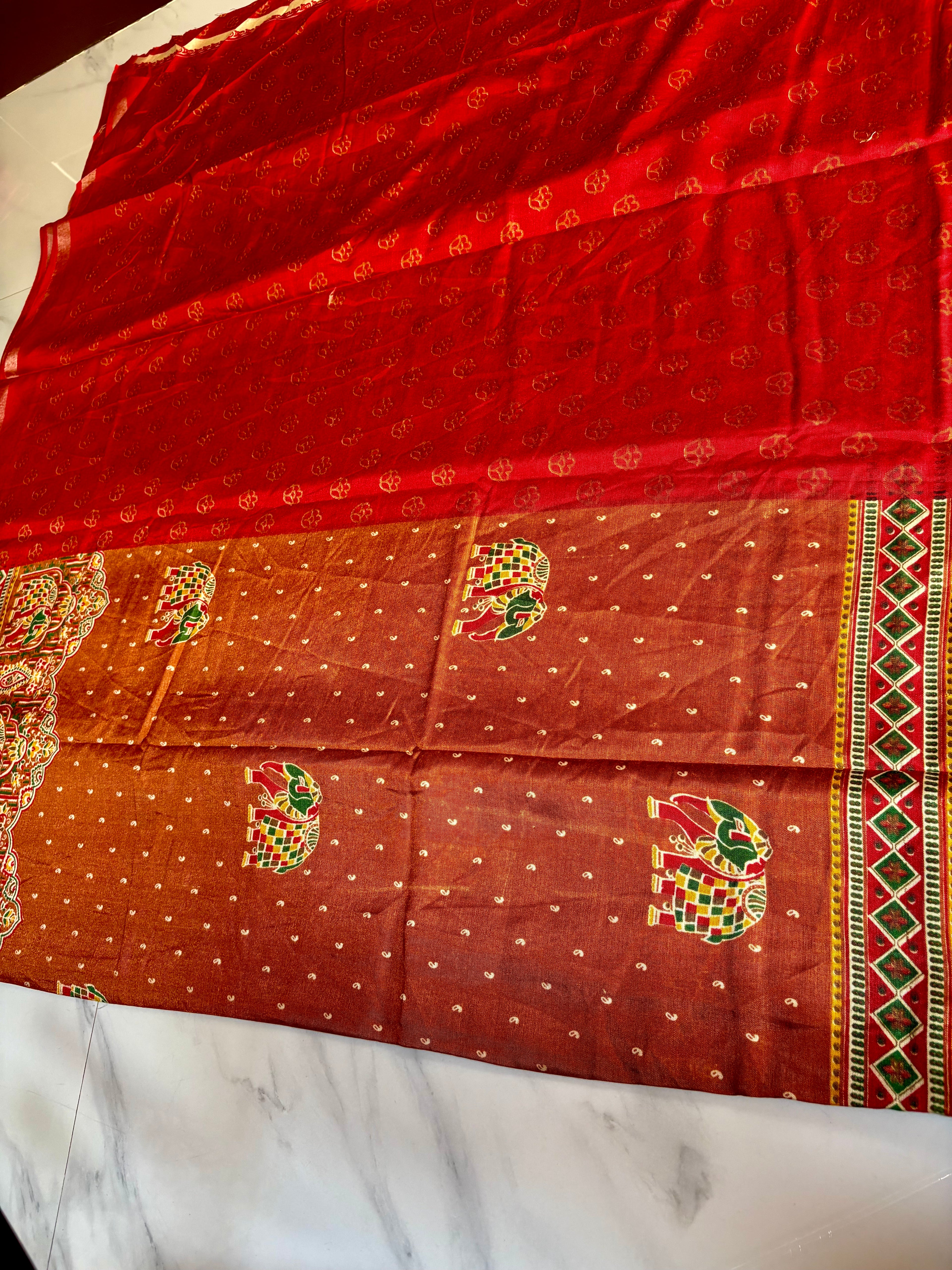 Gracefully designed in a rich rust-orange shade, this saree features elegant elephant and heritage-inspired temple motifs Zari Line border- Cotton silk soft Saree