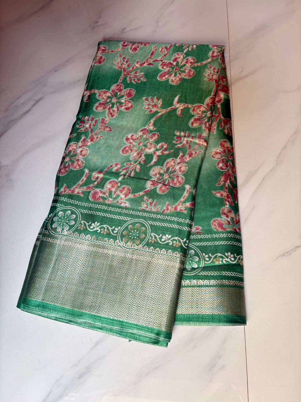 Elegant green floral print saree, beautifully adorned with blooming floral motifs and a shimmering silver zari border- Cotton tissue soft Saree