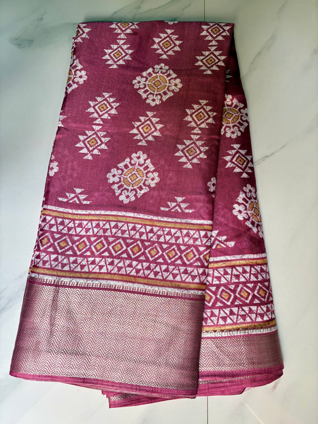 Elegant mauve printed saree, featuring beautiful geometric and floral-inspired motifs complemented by a rich zari border- Cotton tissue soft Saree