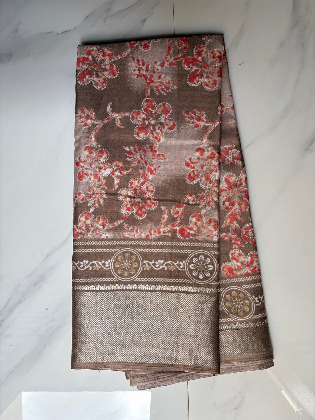 Elegant beige-brown saree featuring delicate coral floral prints and an intricately zari border - Cotton tissue soft Saree