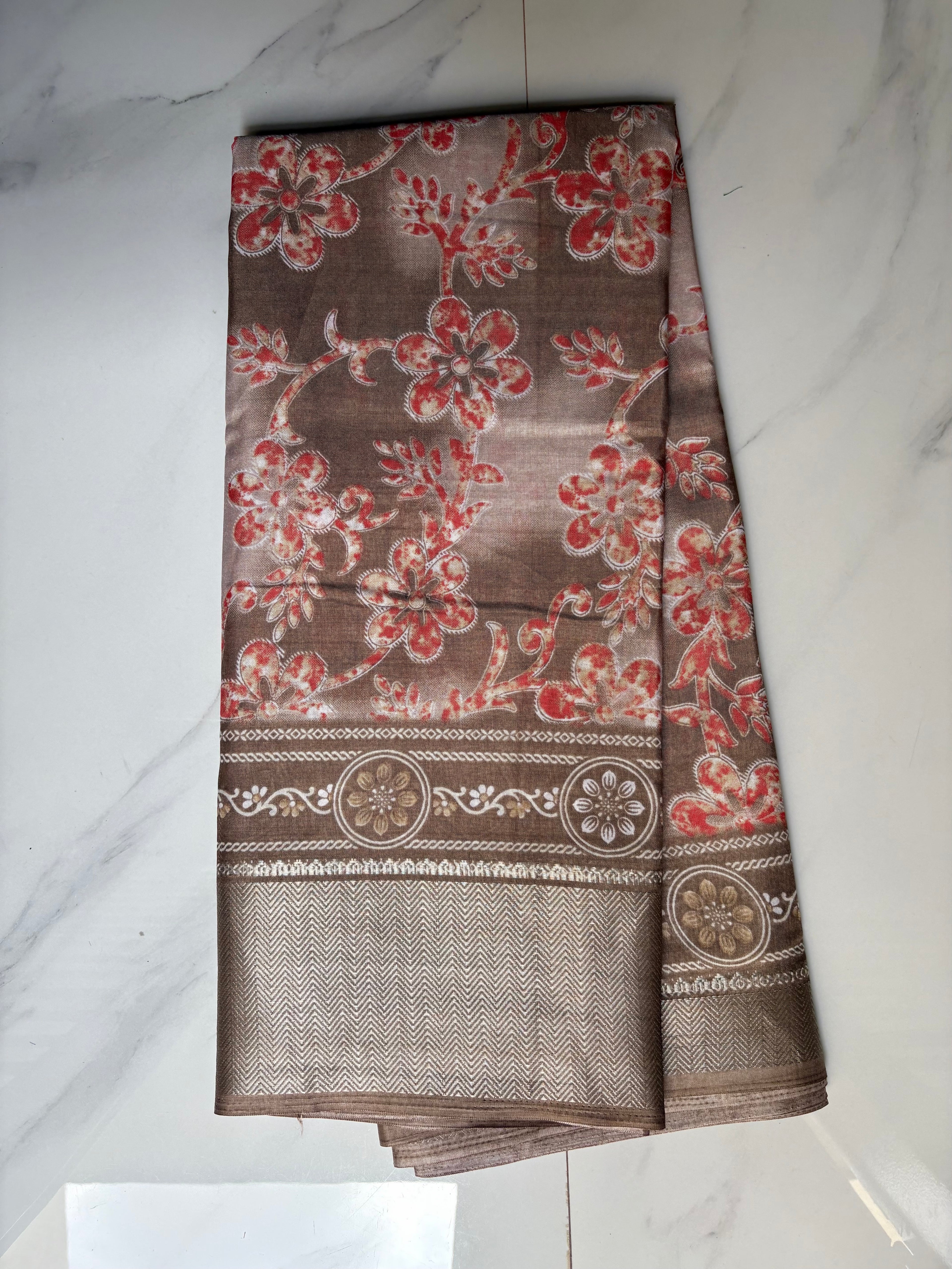 Elegant beige-brown saree featuring delicate coral floral prints and an intricately zari border - Cotton tissue soft Saree