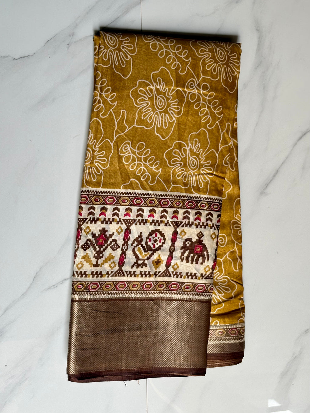 Elegant mustard yellow saree featuring delicate floral prints and a beautifully crafted traditional border - Cotton tissue soft Saree