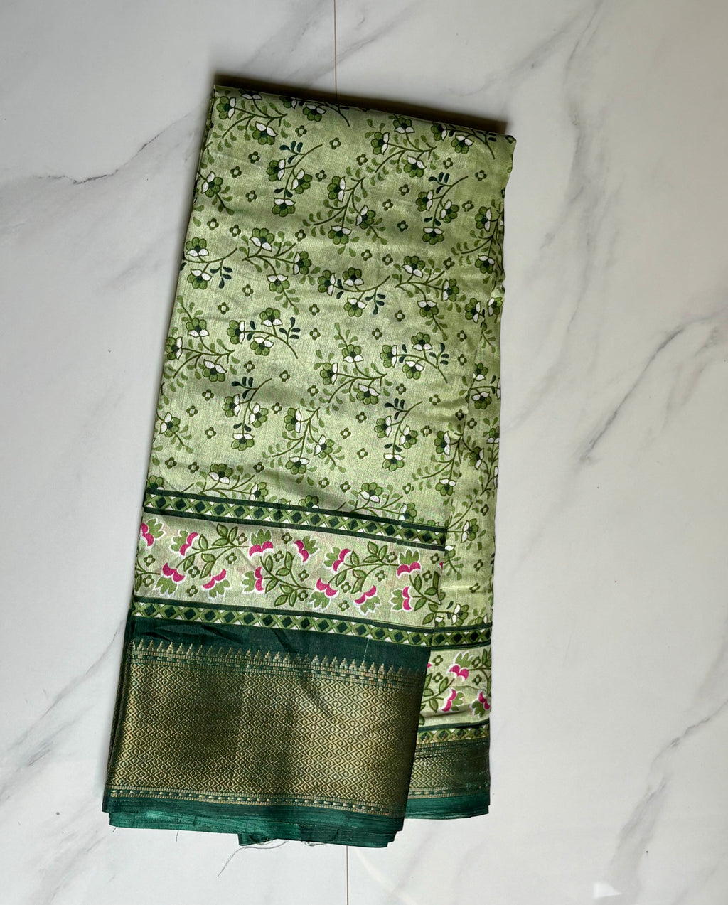 Elegant light green saree featuring delicate floral vine prints and a beautifully designed floral Zari border - Cotton tissue soft Saree