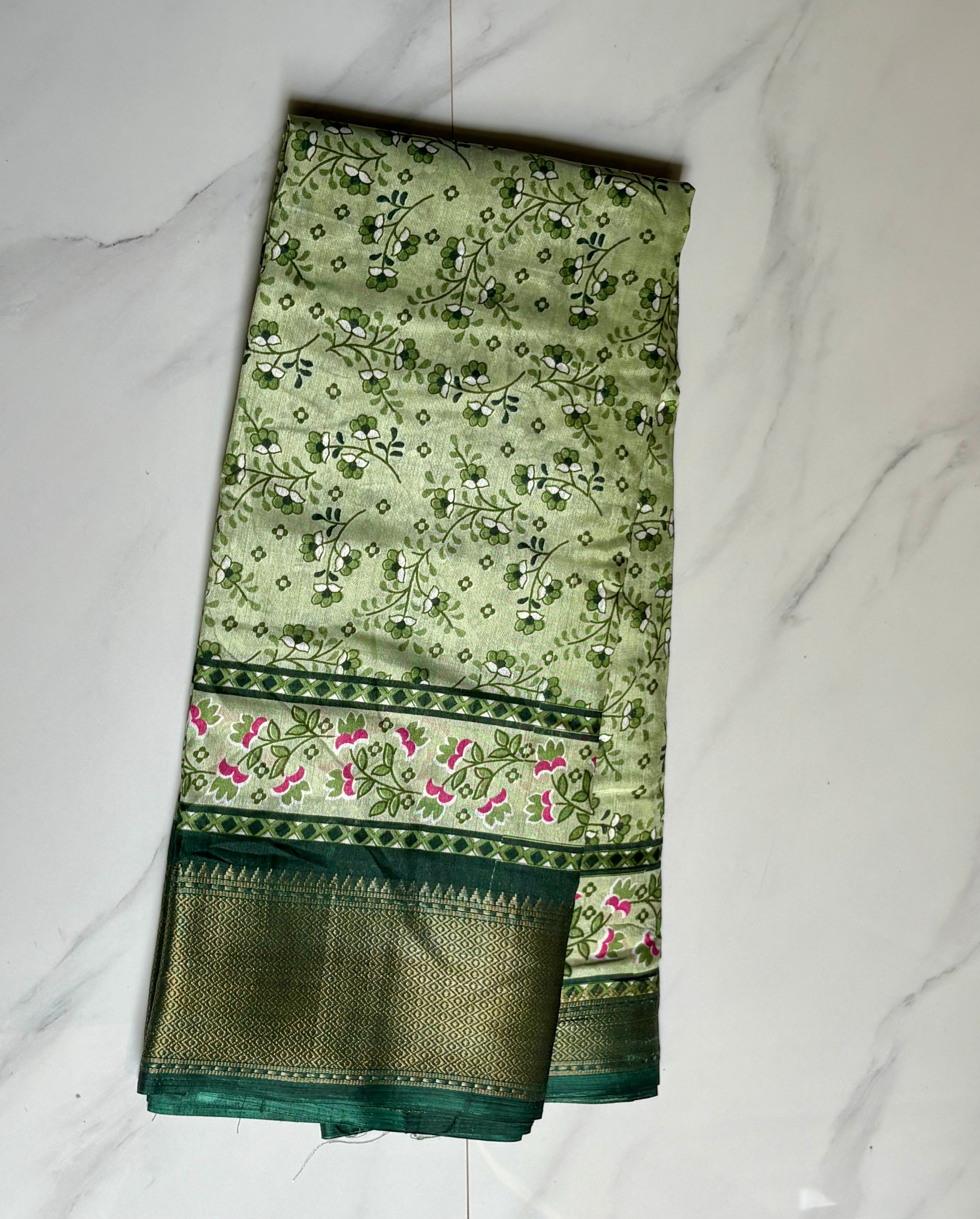 Elegant light green saree featuring delicate floral vine prints and a beautifully designed floral Zari border - Cotton tissue soft Saree