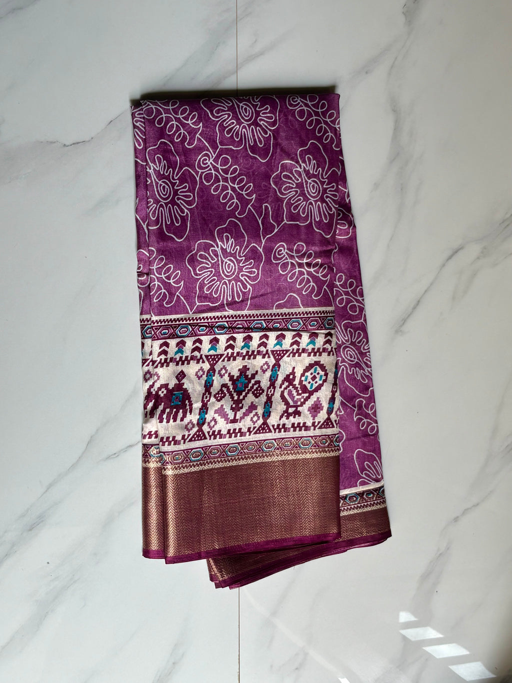 Elegant purple saree featuring graceful floral line prints and a striking ethnic-inspired border - Cotton tissue soft Saree (Copy)