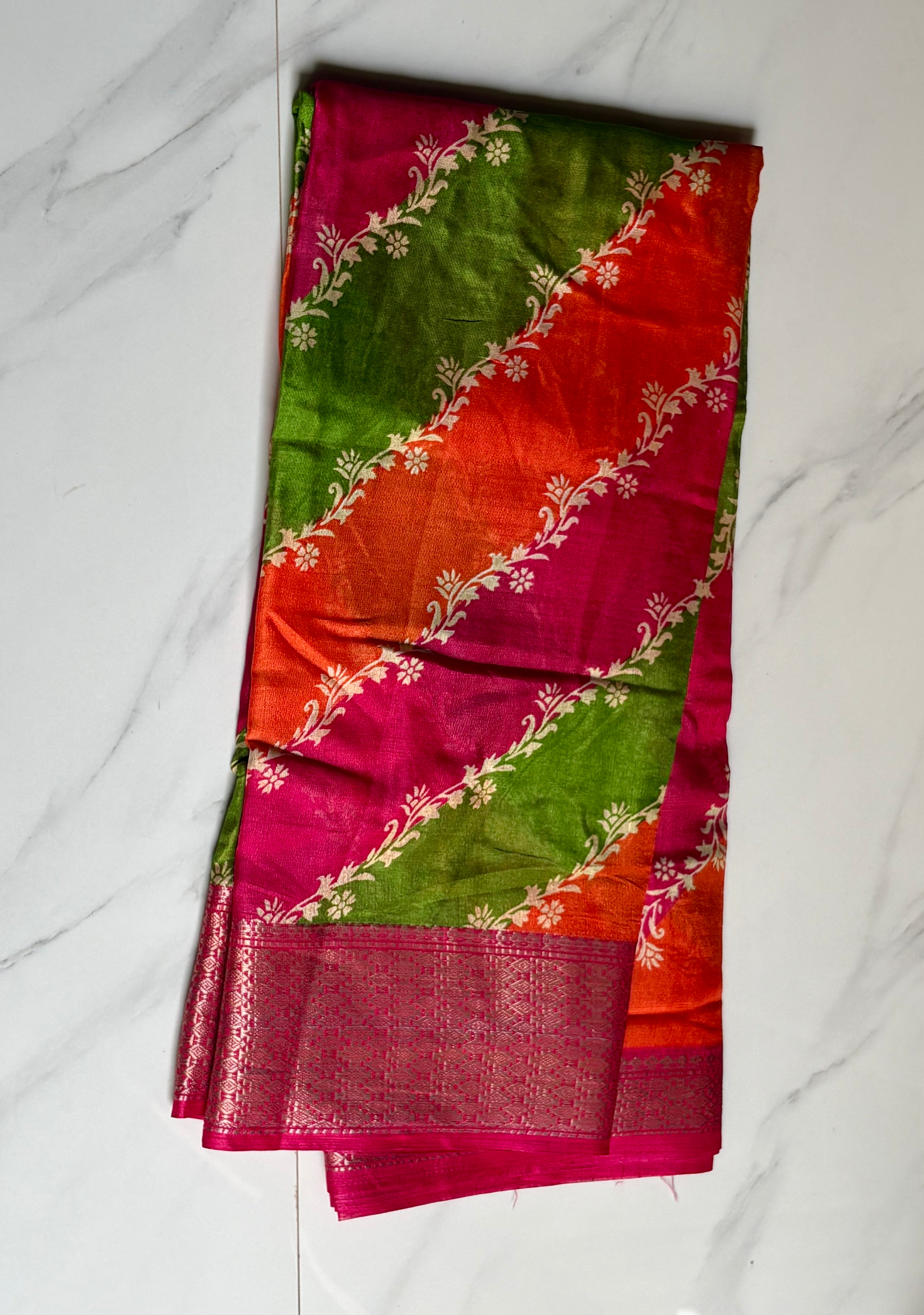 Graceful multicolor saree featuring striking diagonal panels in pink, green, and orange, beautifully accented with delicate floral vine prints with an elegant zari border - Cotton tissue soft Saree