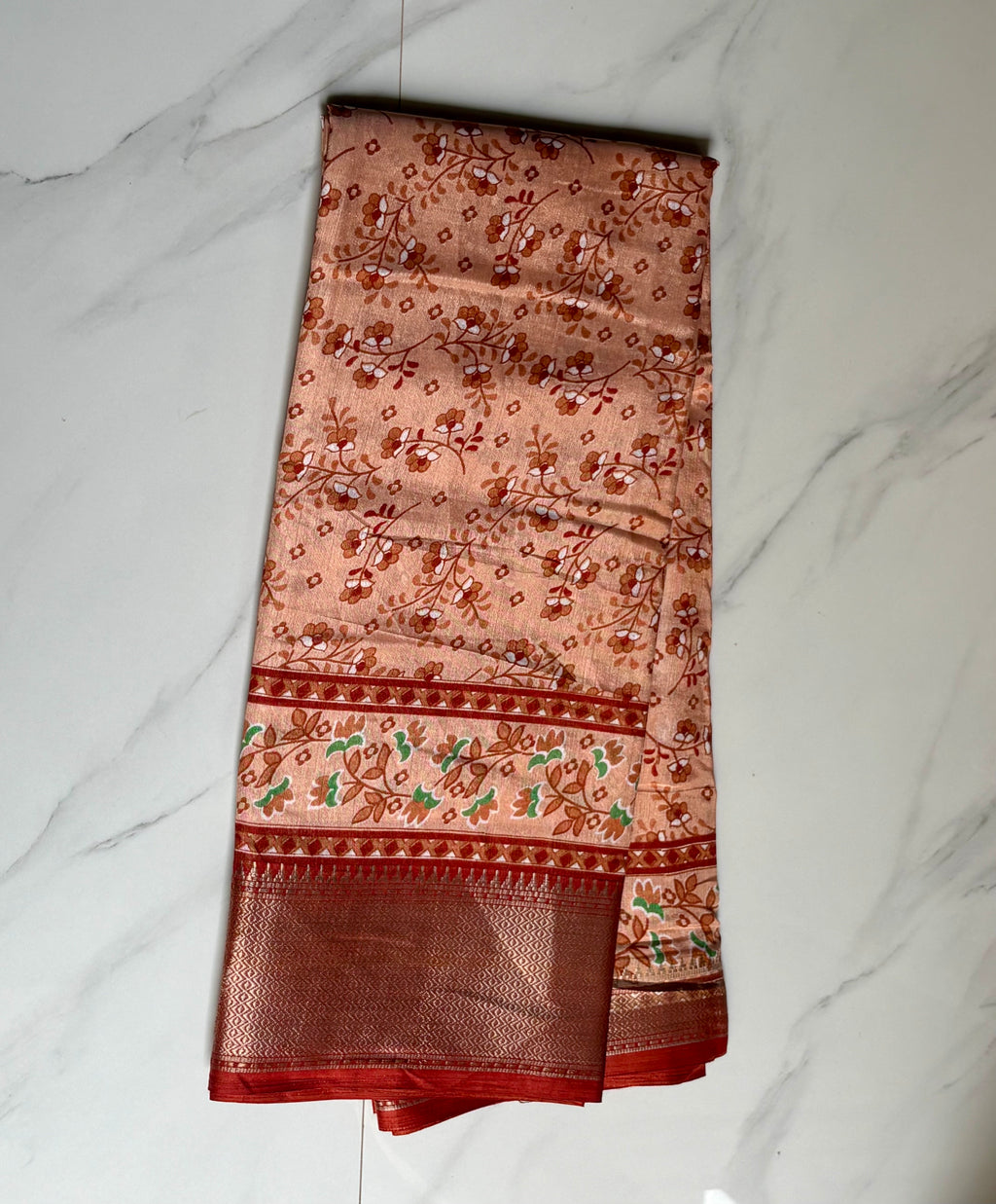 Elegant peach saree adorned with delicate floral prints and a beautifully zari border - Cotton tissue soft Saree