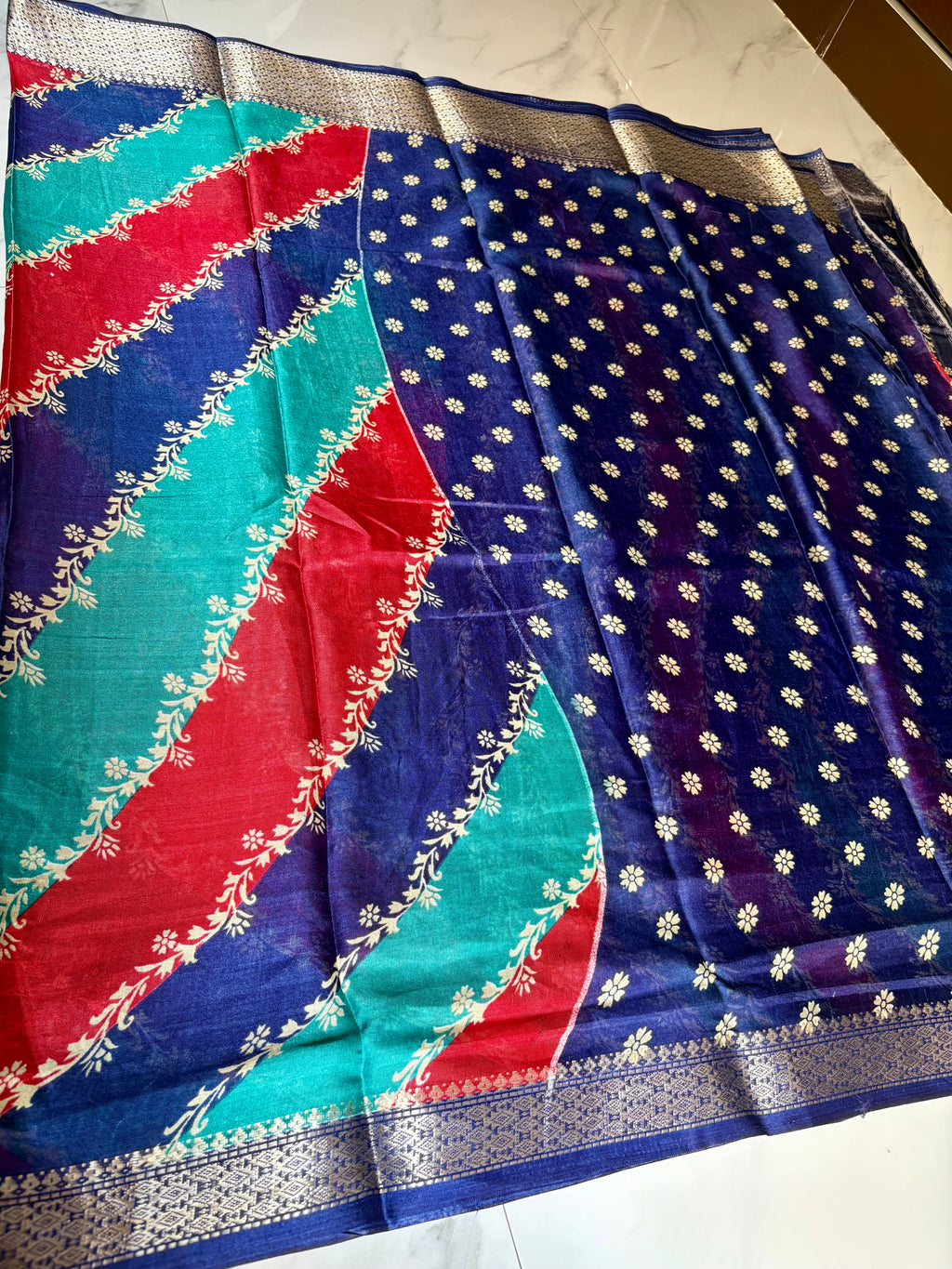 Elegant multicolor saree featuring vibrant diagonal stripes in red, teal, and navy blue, and a rich zari border- Cotton tissue soft Saree
