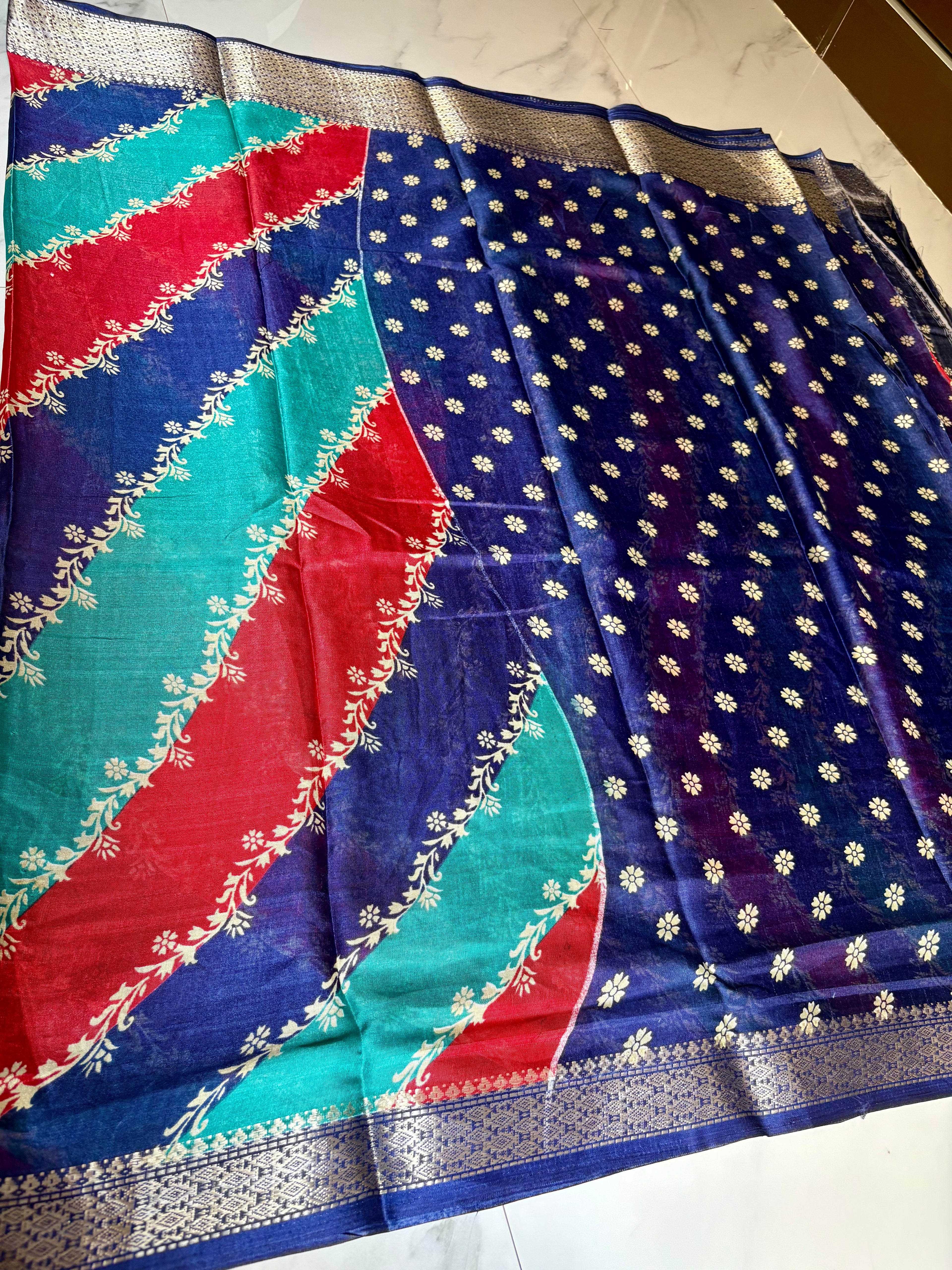 Elegant multicolor saree featuring vibrant diagonal stripes in red, teal, and navy blue, and a rich zari border- Cotton tissue soft Saree