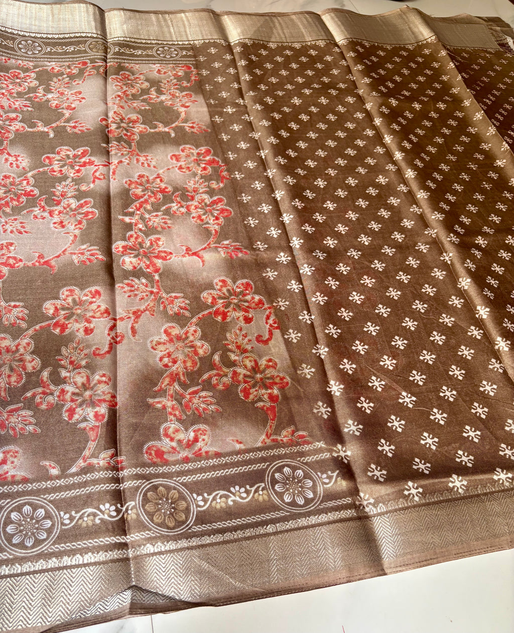 Elegant beige-brown saree featuring delicate coral floral prints and an intricately zari border - Cotton tissue soft Saree