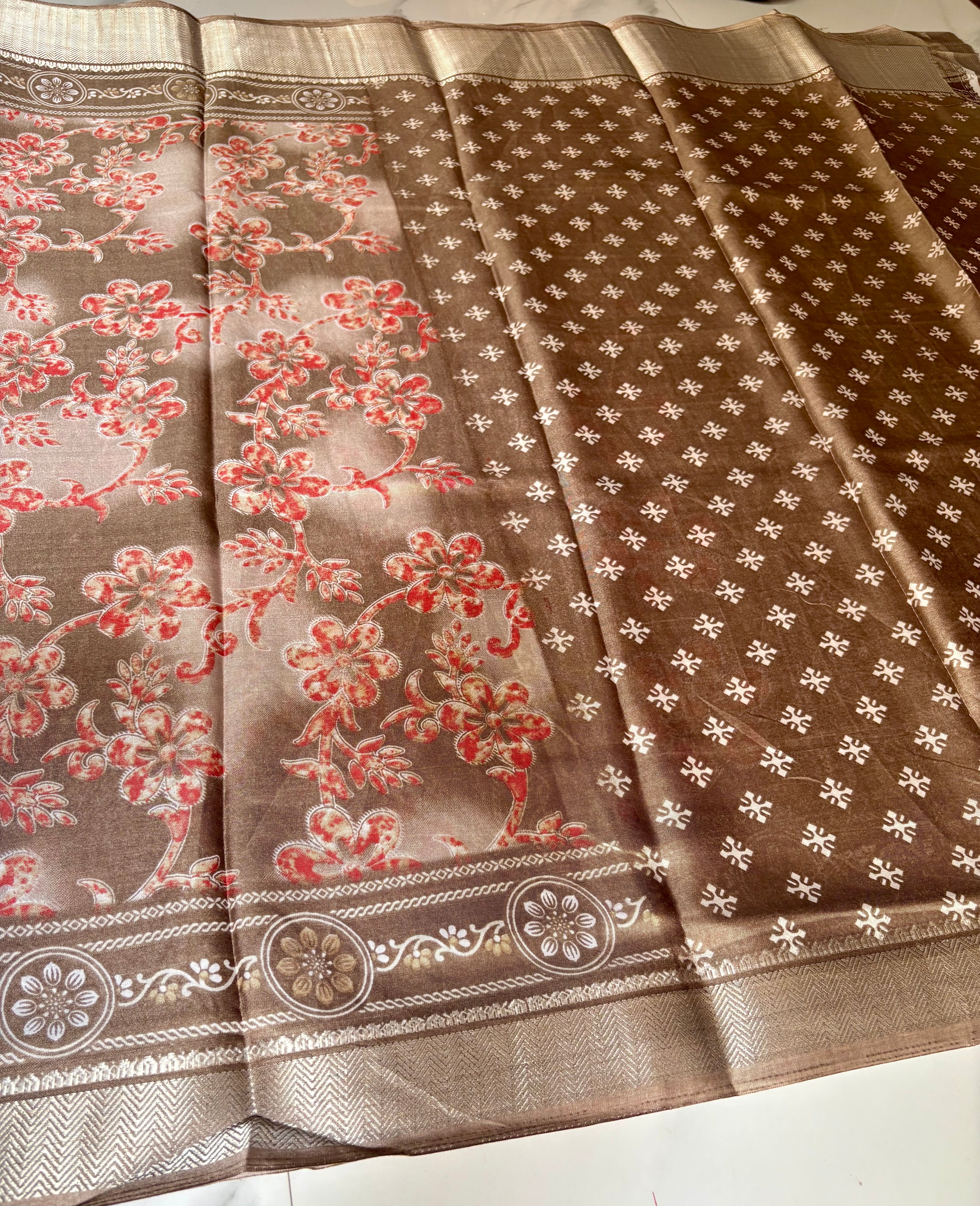 Elegant beige-brown saree featuring delicate coral floral prints and an intricately zari border - Cotton tissue soft Saree