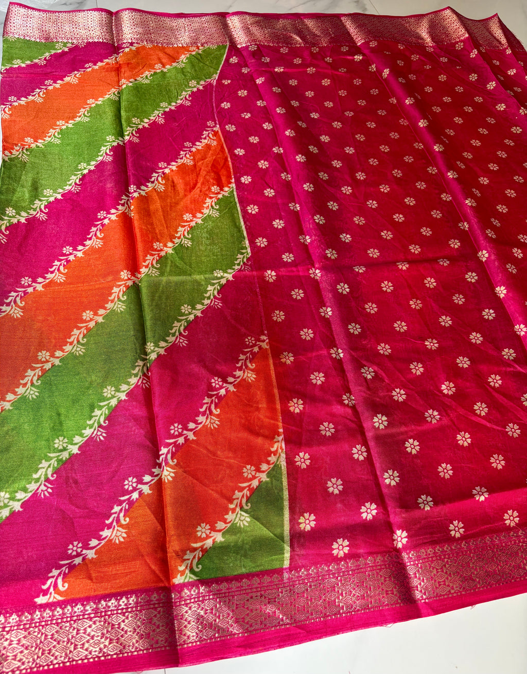 Graceful multicolor saree featuring striking diagonal panels in pink, green, and orange, beautifully accented with delicate floral vine prints with an elegant zari border - Cotton tissue soft Saree