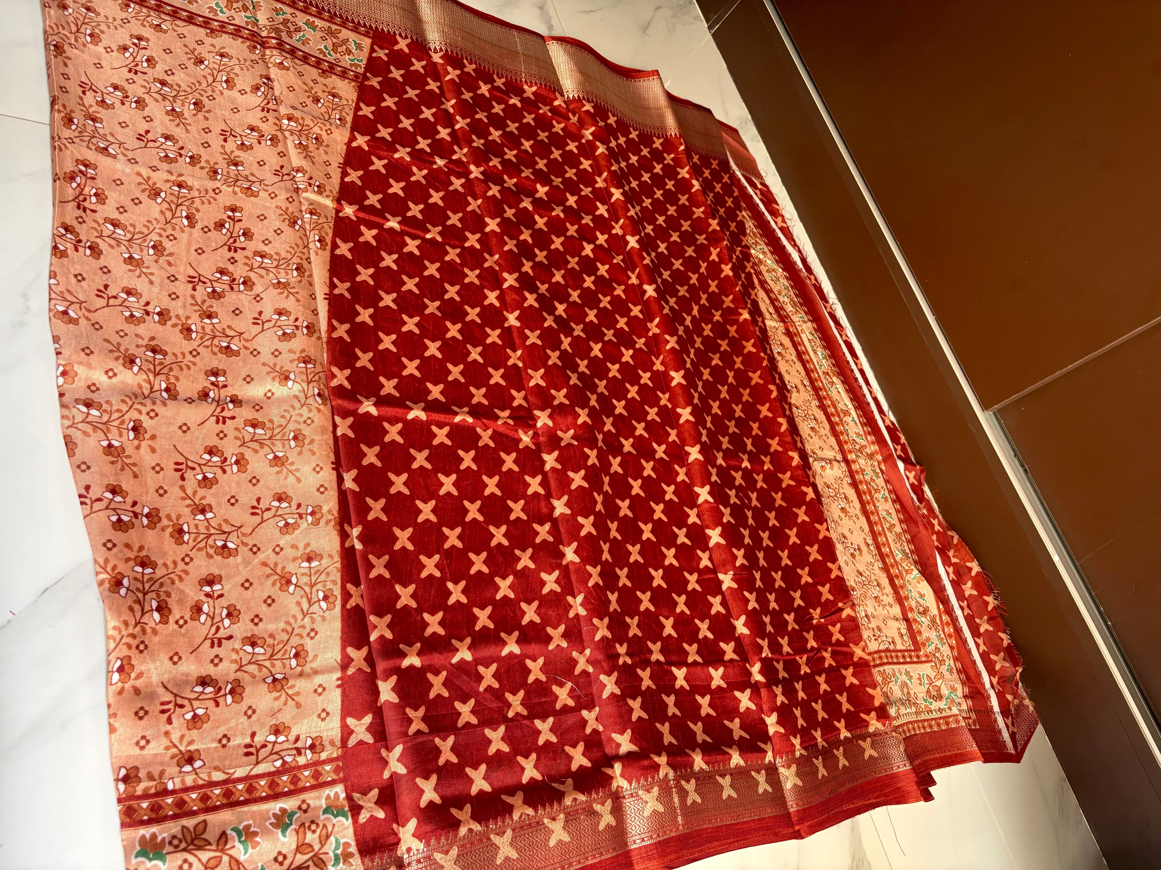 Elegant peach saree adorned with delicate floral prints and a beautifully zari border - Cotton tissue soft Saree