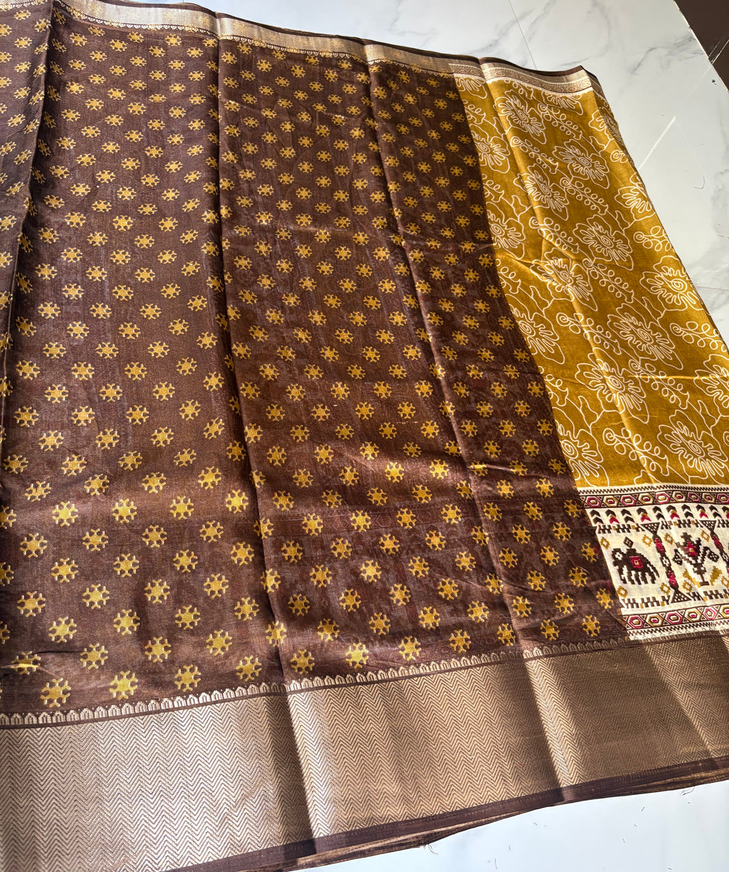 Elegant mustard yellow saree featuring delicate floral prints and a beautifully crafted traditional border - Cotton tissue soft Saree
