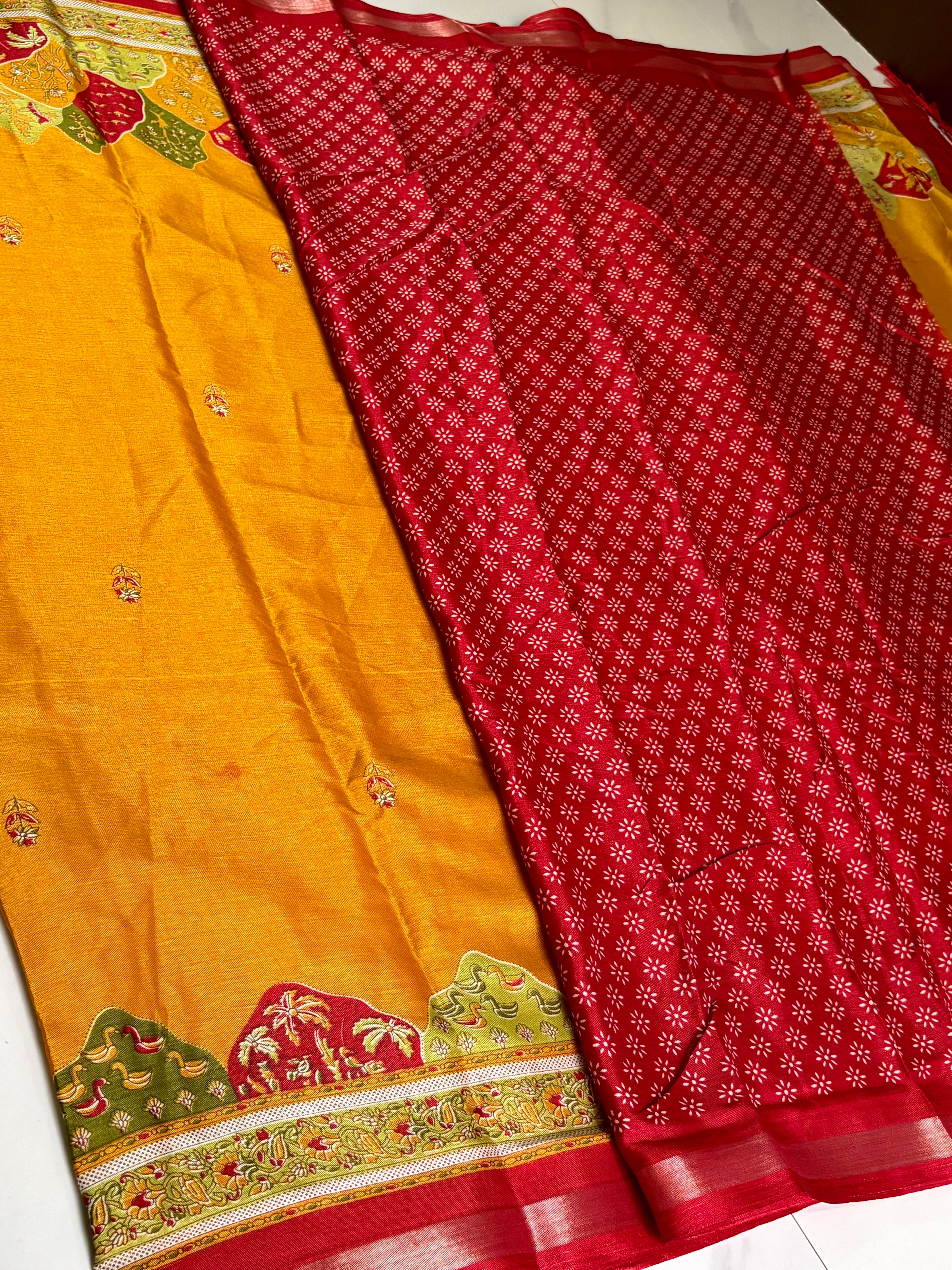 Elegant mustard yellow saree featuring delicate floral butti and a beautifully crafted multicolor scenic Zari border -with  Tassels.