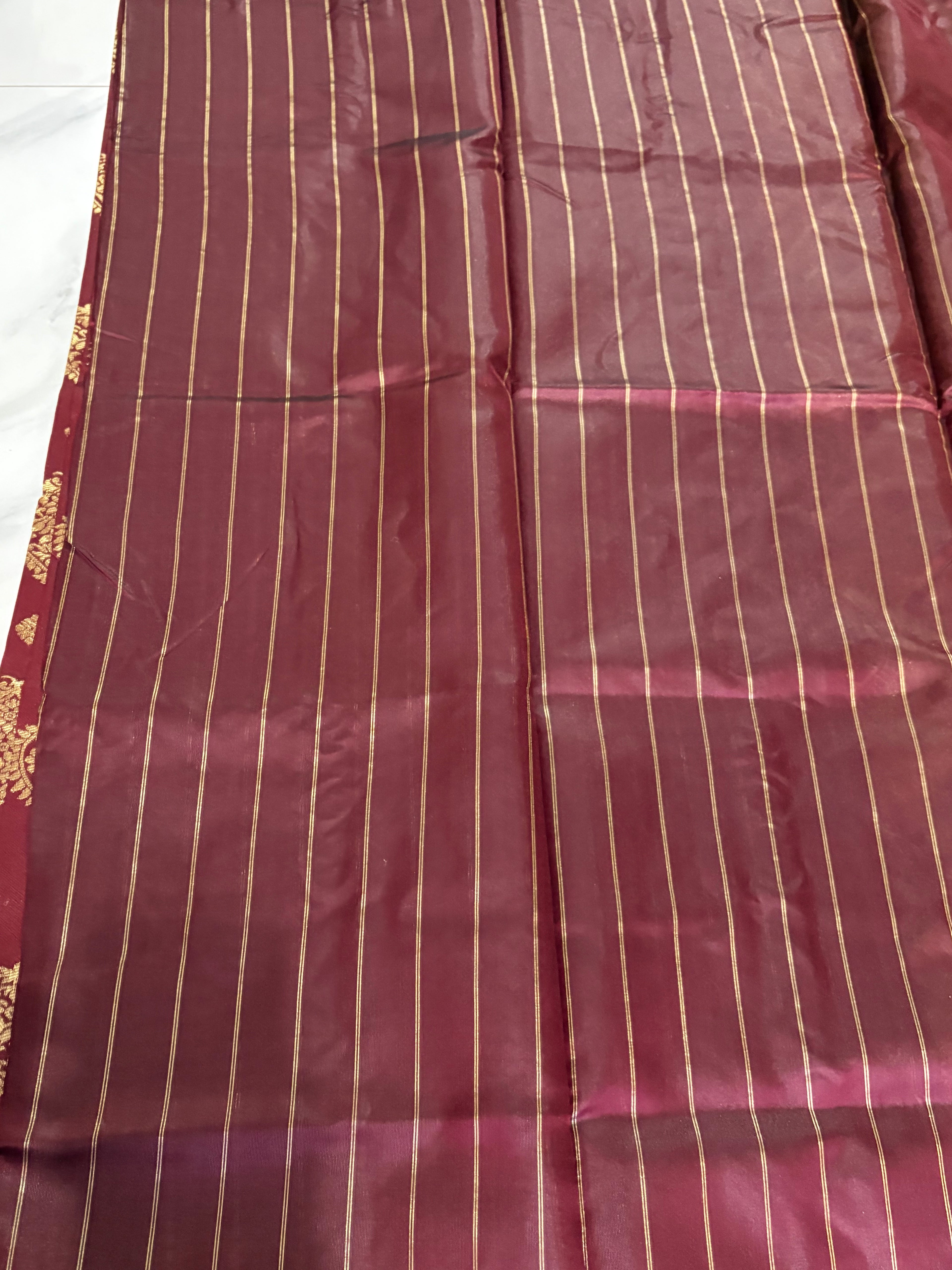 Beautiful Lichi Silk Maroon Saree with Gold Zari Border -  Traditional Motifs