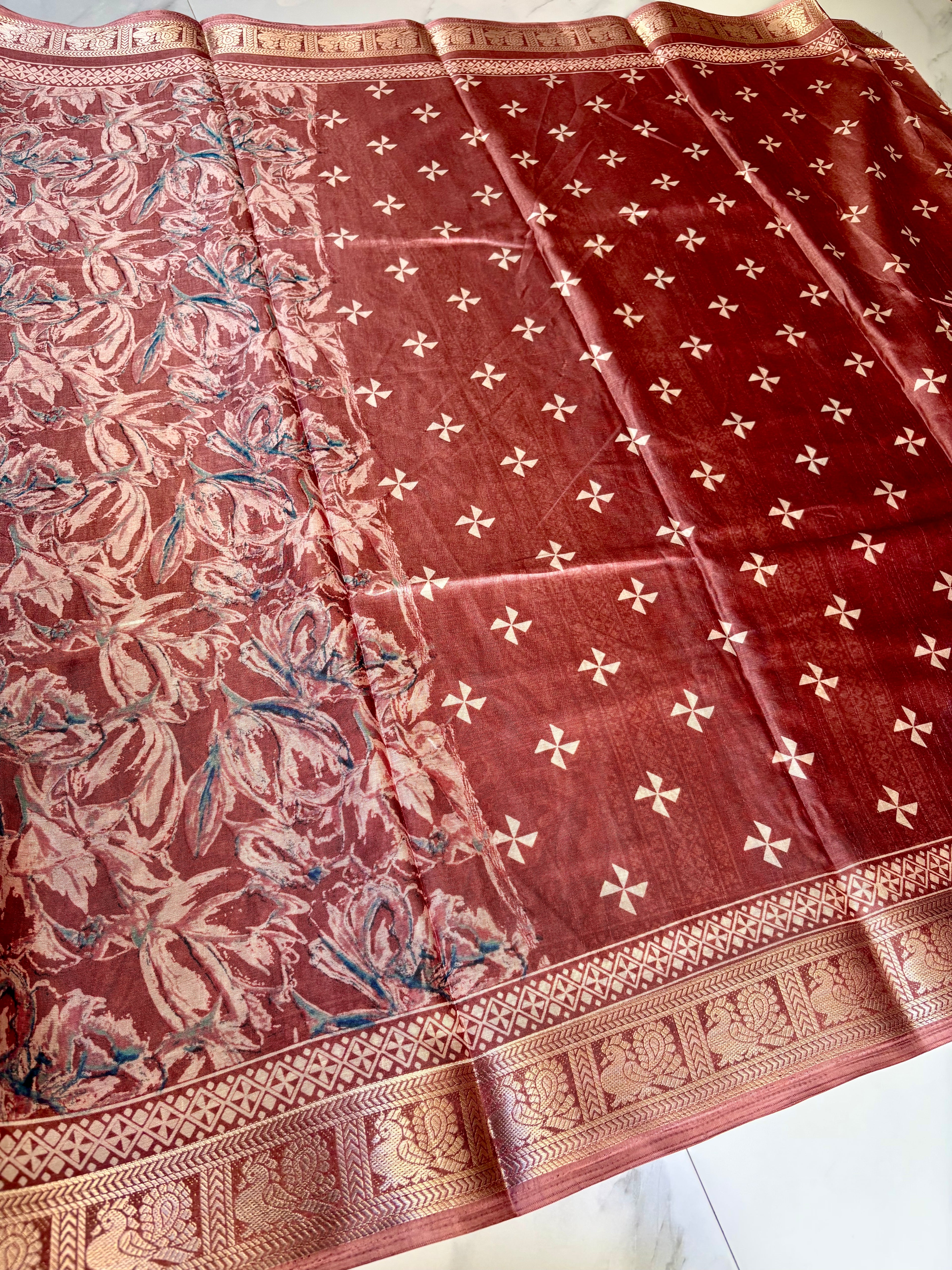 Elegant dusty rose saree featuring an all-over floral print and a rich golden woven border - Satin Tissue Saree