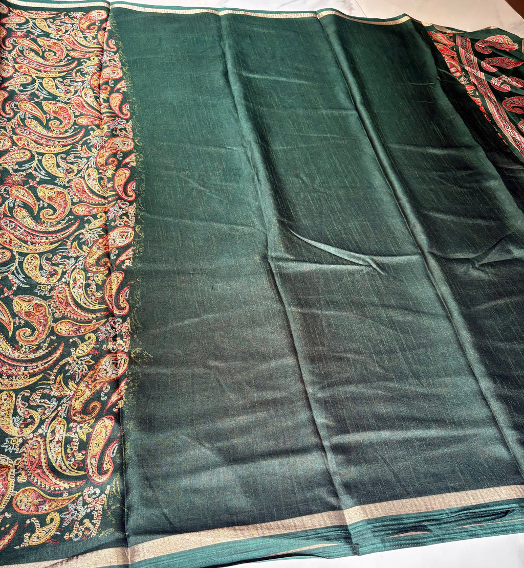 Elegant dark green saree featuring intricate multicolor paisley prints and subtle golden edging.