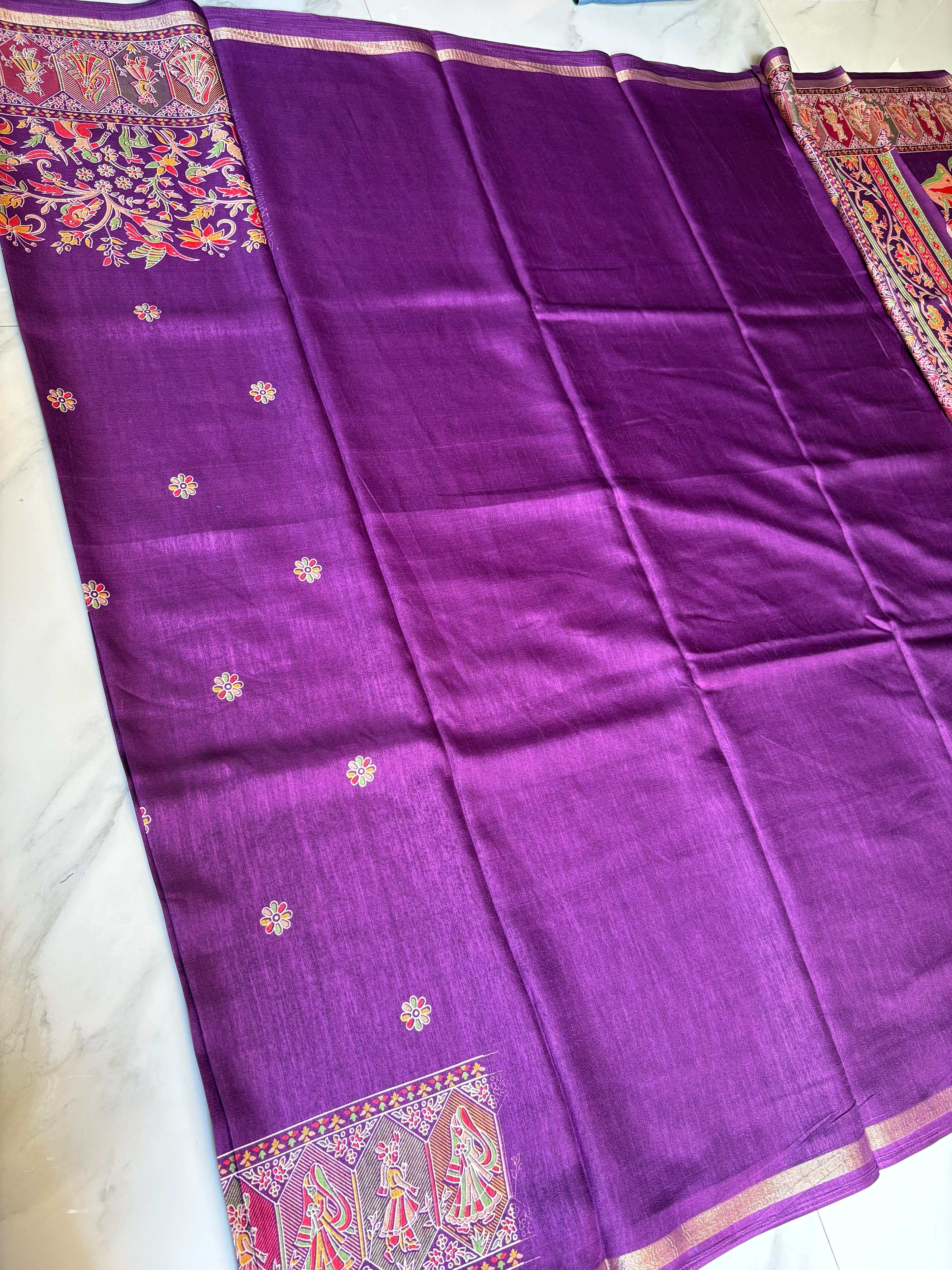 Elegant royal purple shade features delicate floral butta motifs across the body and subtle golden edging.