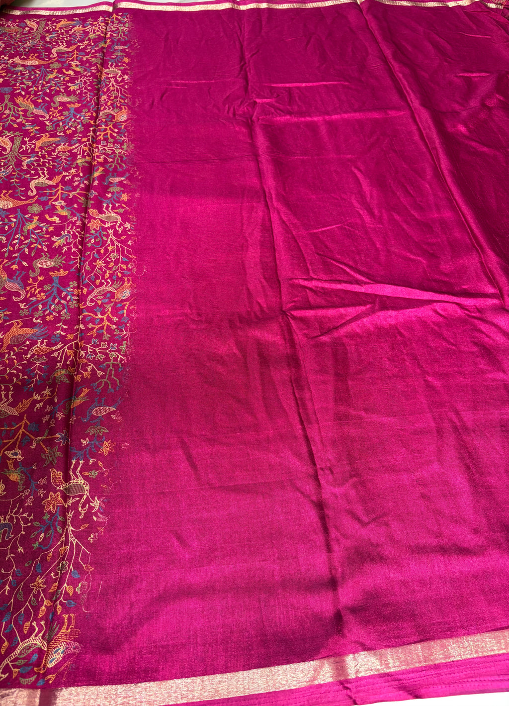 Elegant magenta saree featuring intricate nature-inspired bird and floral prints and subtle golden edging.