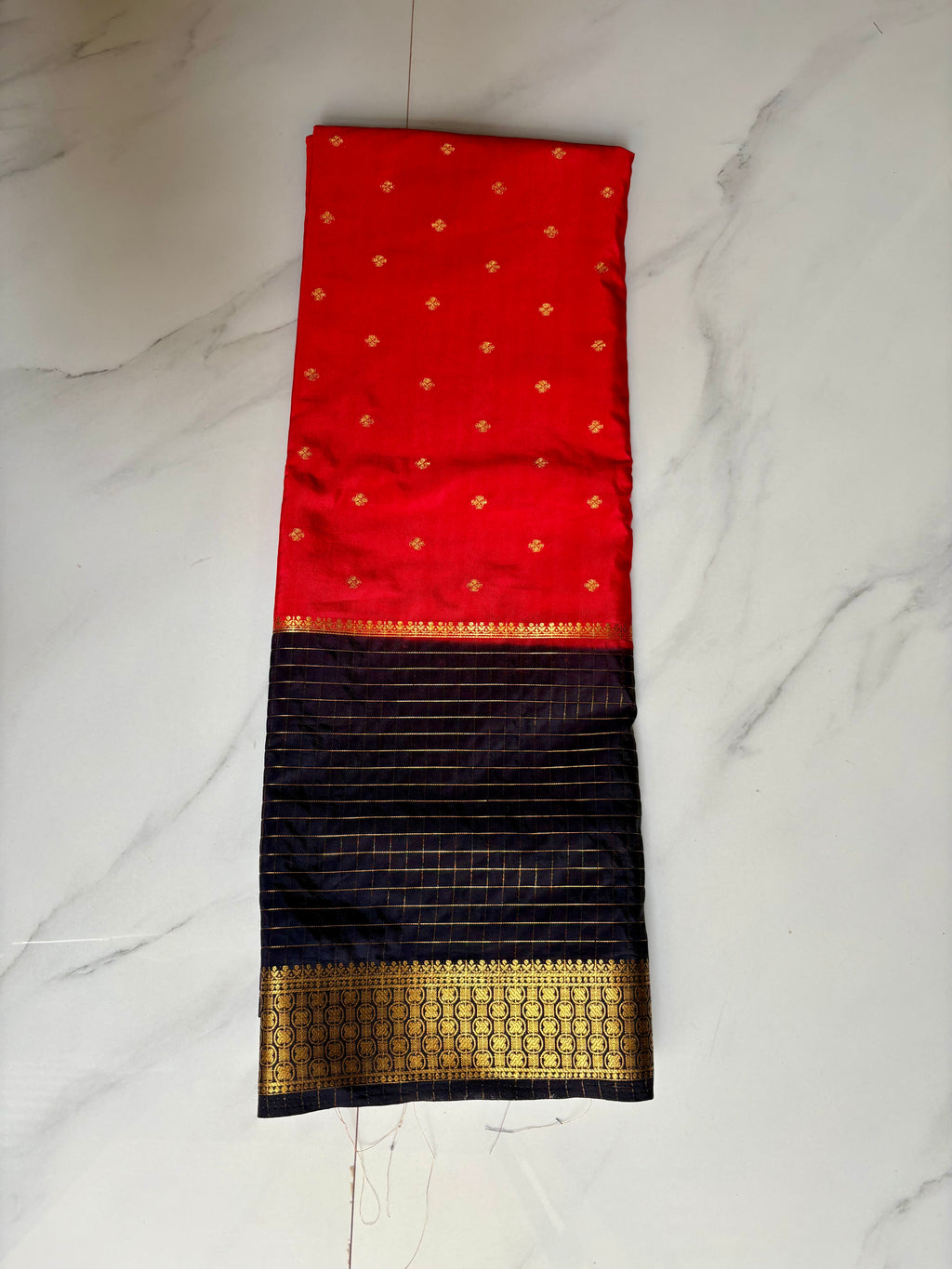 Premium Crape Chex Patti Saree with Orange and Black Colour Combination and Premium Woven Zari Border.