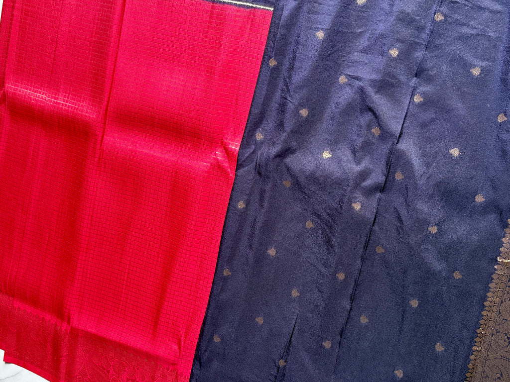 Elegant Crepe Semi Silk dual-tone saree featuring a vibrant pink body and a rich navy blue, accented with intricate zari motifs and border.