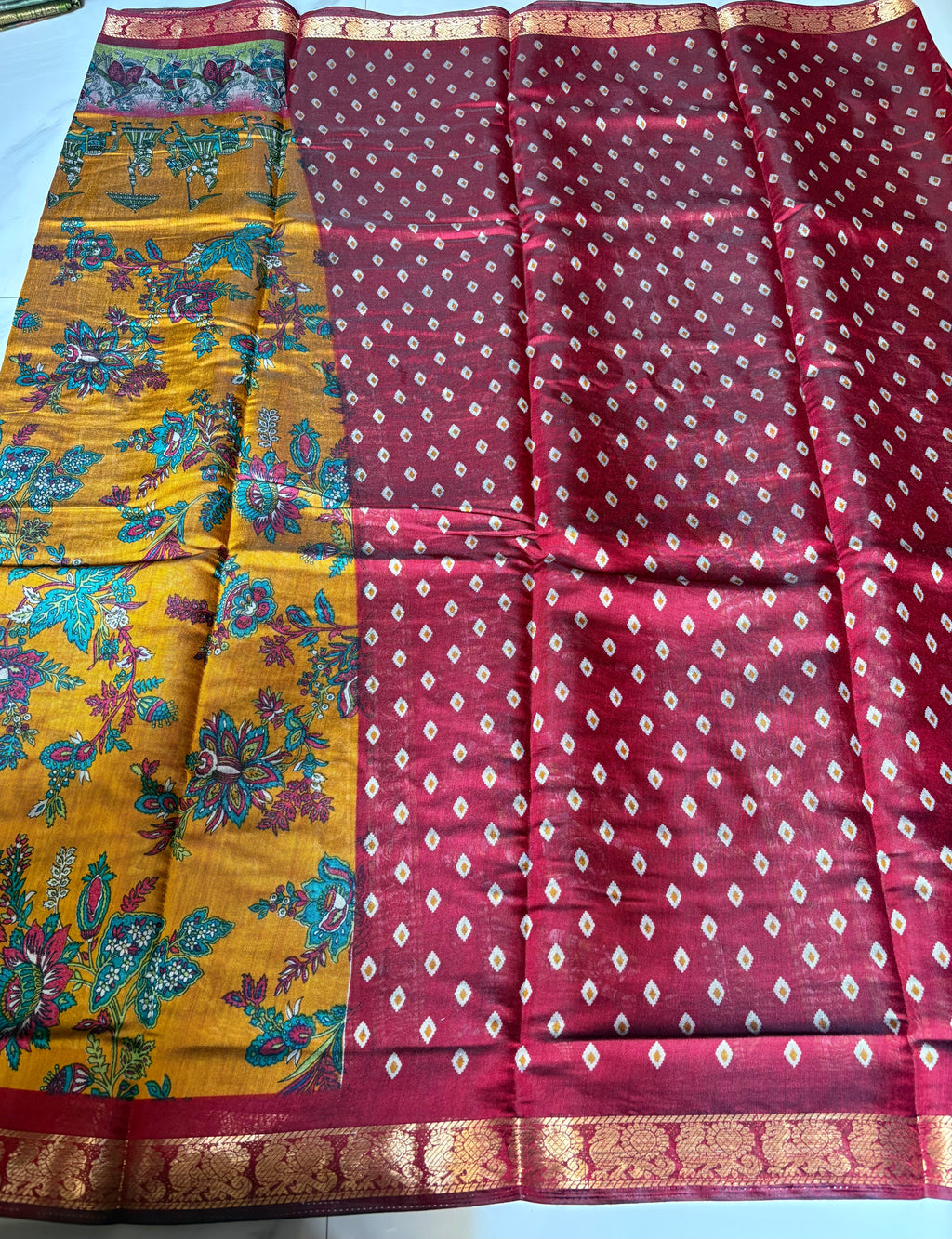 Elegant mustard brown saree, with vibrant floral prints and detailed heritage-inspired with a rich zari border